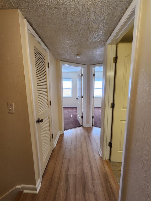 501 Southwest 75th Street, Unit A14 Gainesville, FL 32607 - Photo 47 of 56 wooden floor in a gallery