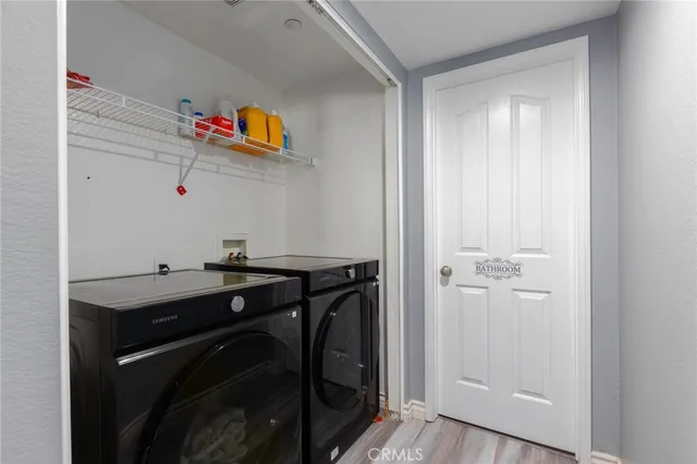 a utility room with a sink dryer and washer
