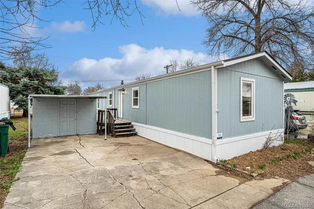 a kitchen with stainless steel appliances a refrigerator and a stove top oven