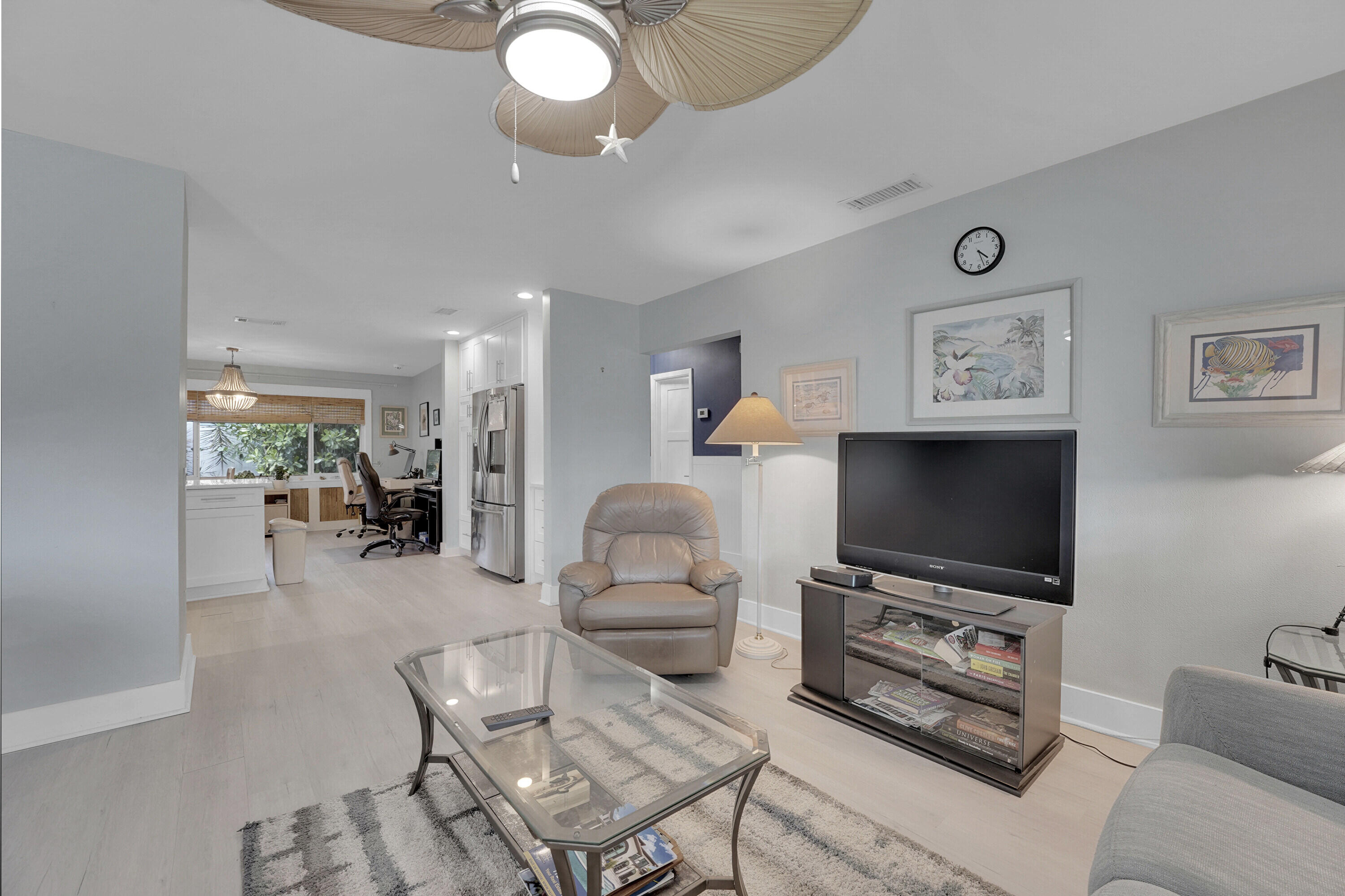 1708 Sunset Isles Road Fort Pierce, FL 34949 - Photo 11 of 52 a living room with furniture and a flat screen tv
