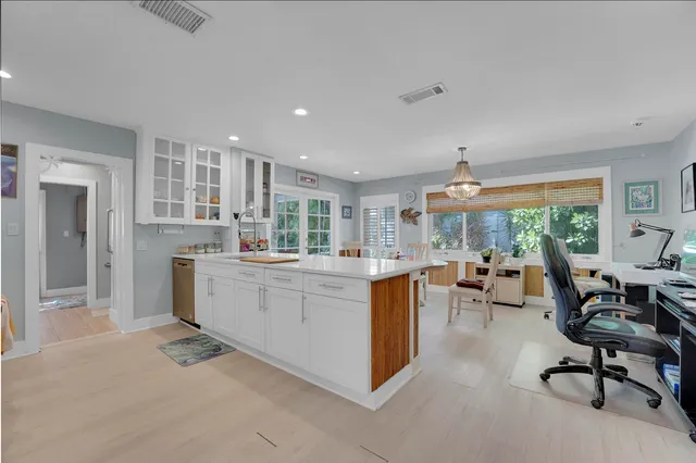 a kitchen with sink a counter and workspace