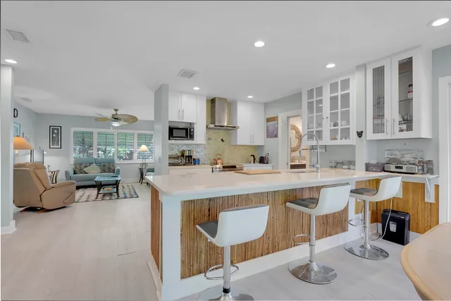a kitchen with counter top space and appliances