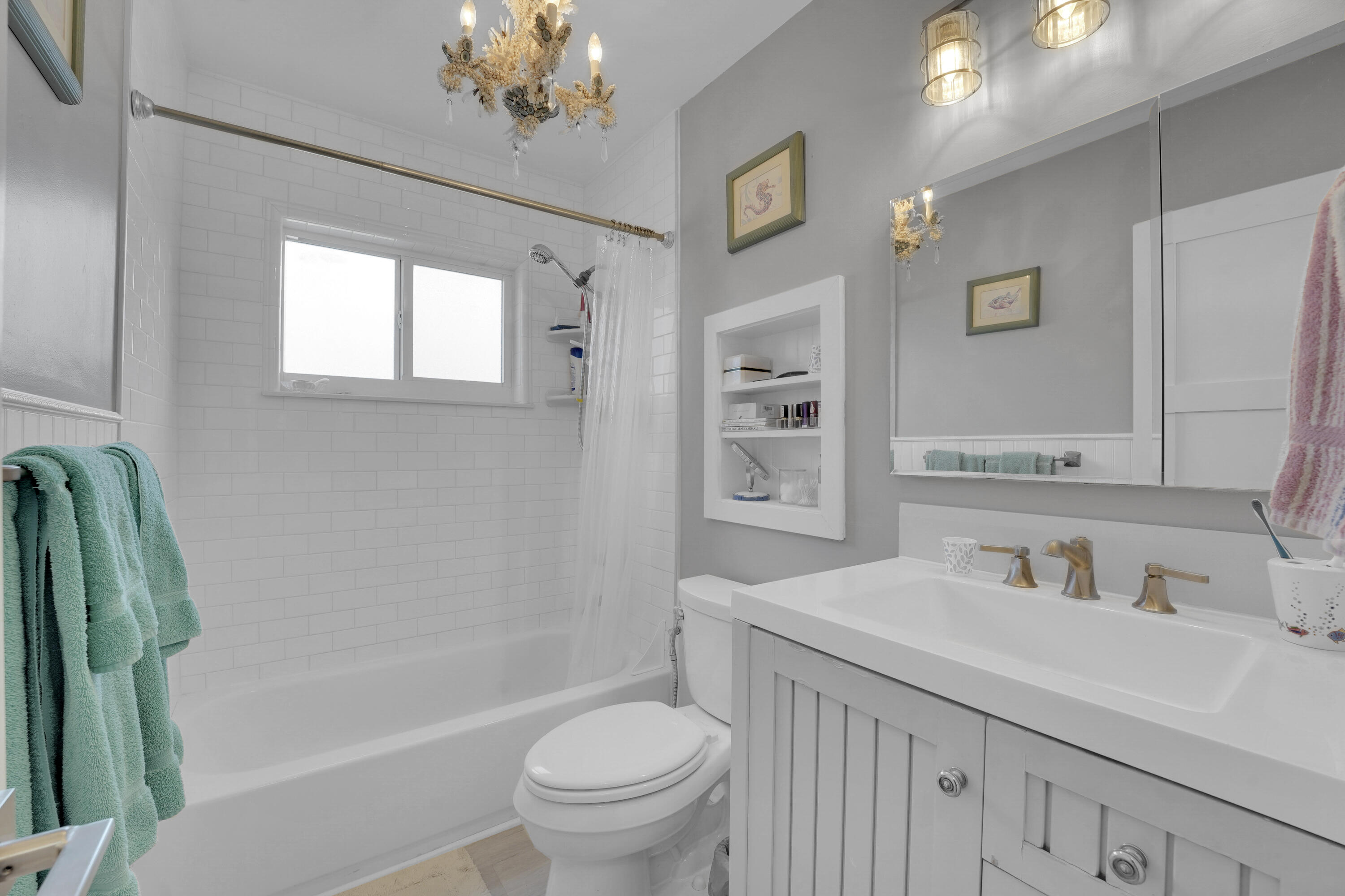 1708 Sunset Isles Road Fort Pierce, FL 34949 - Photo 22 of 52 a bathroom with a sink a toilet and a bathtub