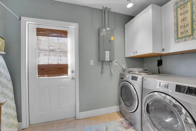 a view of storage and utility room with washer and dryer
