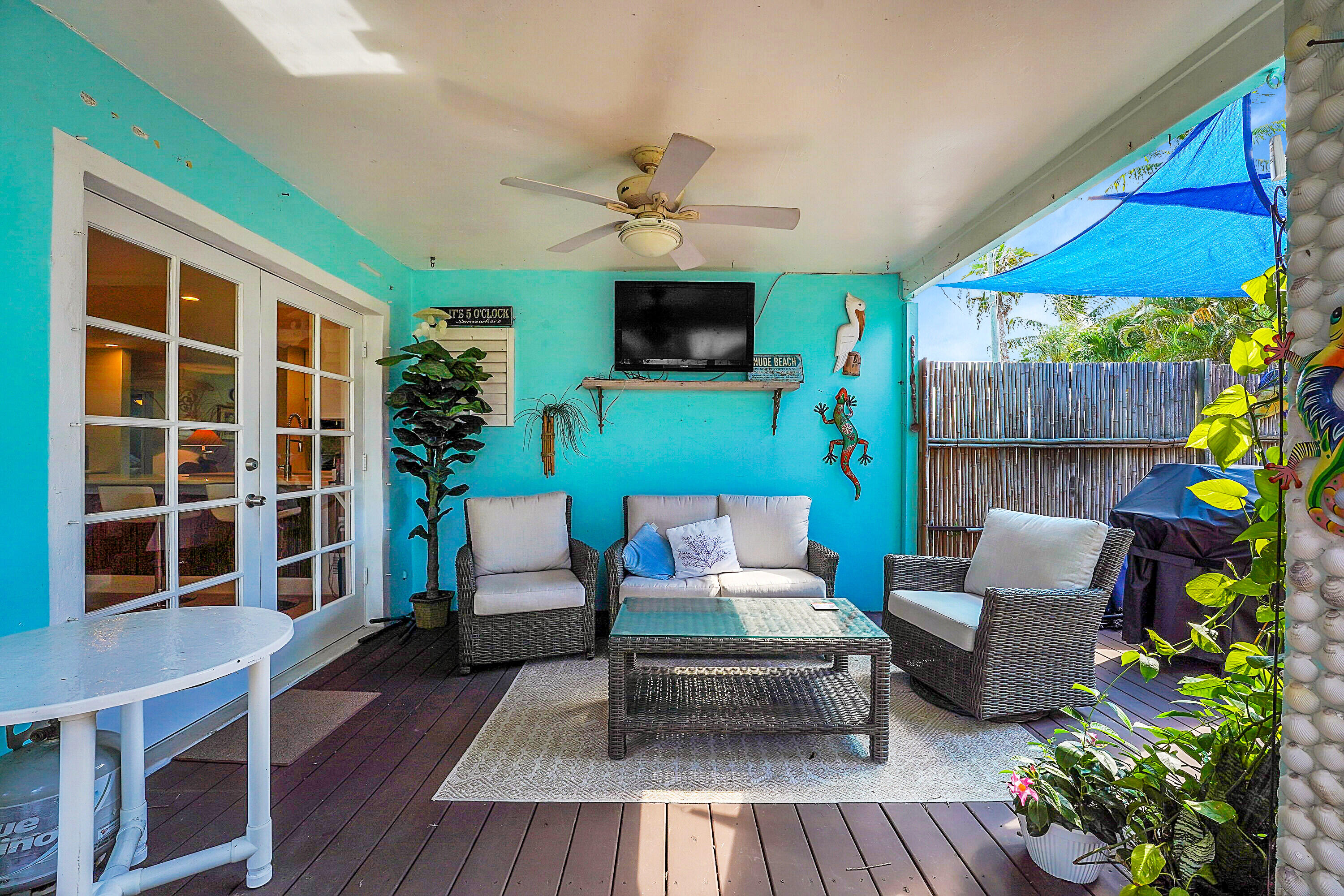1708 Sunset Isles Road Fort Pierce, FL 34949 - Photo 28 of 52 a outdoor living space with furniture and a flat screen tv