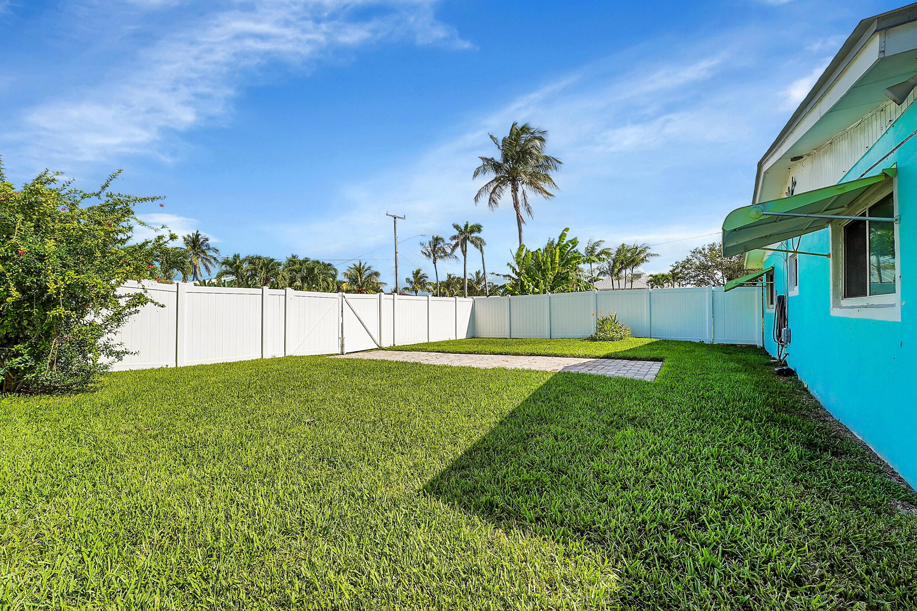 1708 Sunset Isles Road Fort Pierce, FL 34949 - Photo 34 of 52 a view of a house with a backyard