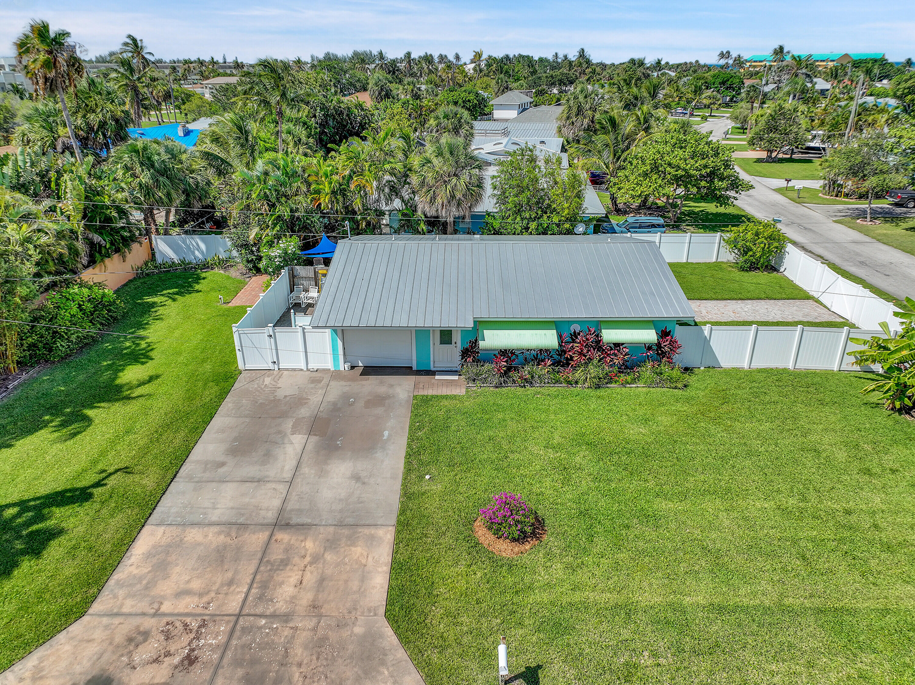 1708 Sunset Isles Road Fort Pierce, FL 34949 - Photo 37 of 52 a view of a back yard of the house with green space