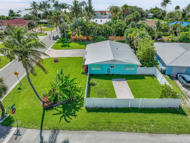 an aerial view of residential houses with outdoor space