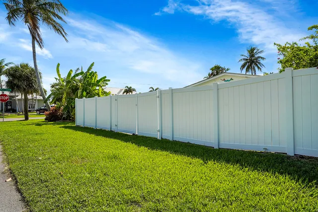a view of a backyard with potted plants