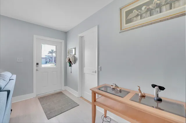 a room that has a couch and a dresser in it