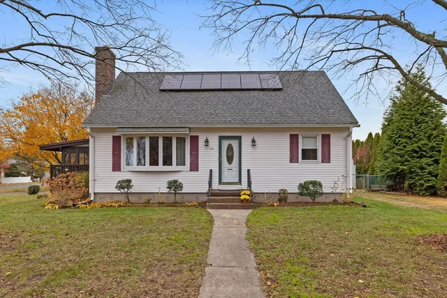 a view of a house with a yard