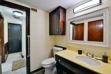 11470 Massey Road Pilot Point, TX 76258 - Photo 18 of 39 a bathroom with a sink and a mirror