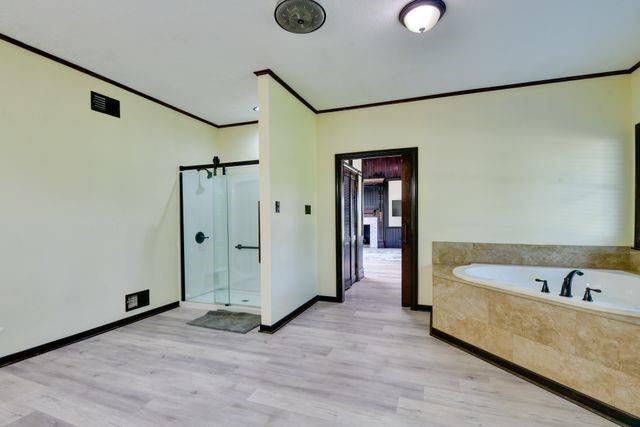 11470 Massey Road Pilot Point, TX 76258 - Photo 20 of 39 a view of a bathtub in a room