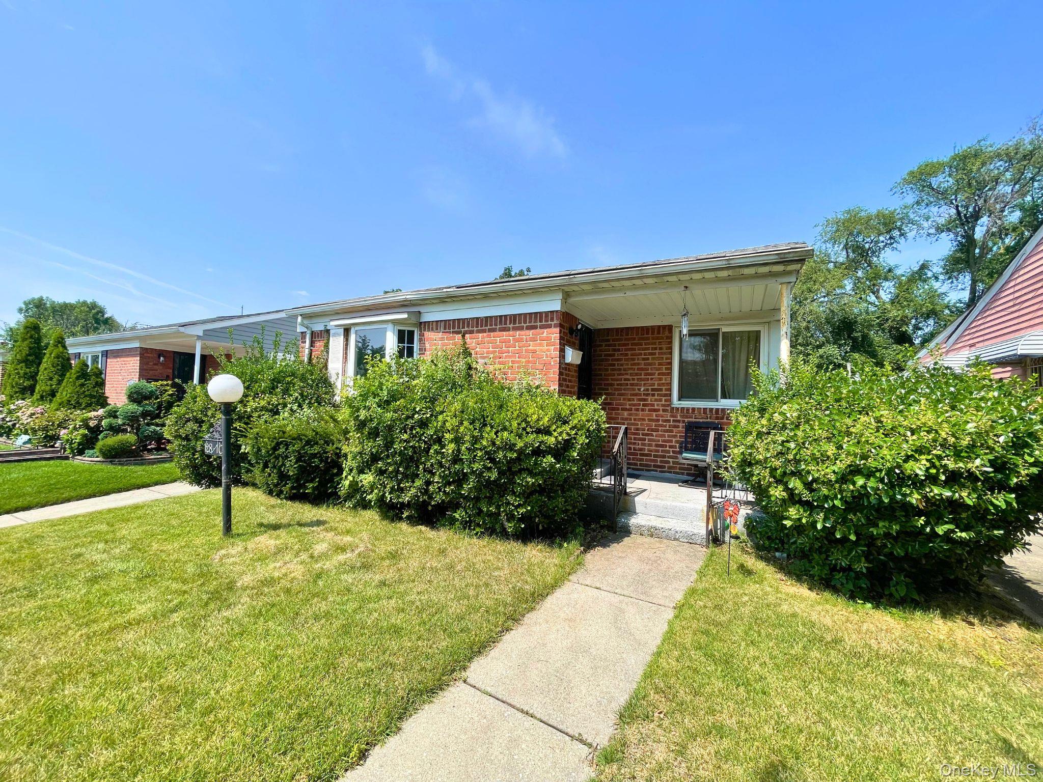 128-10 236th Street Queens, NY 11422 - Photo 2 of 5 a house view with a garden space