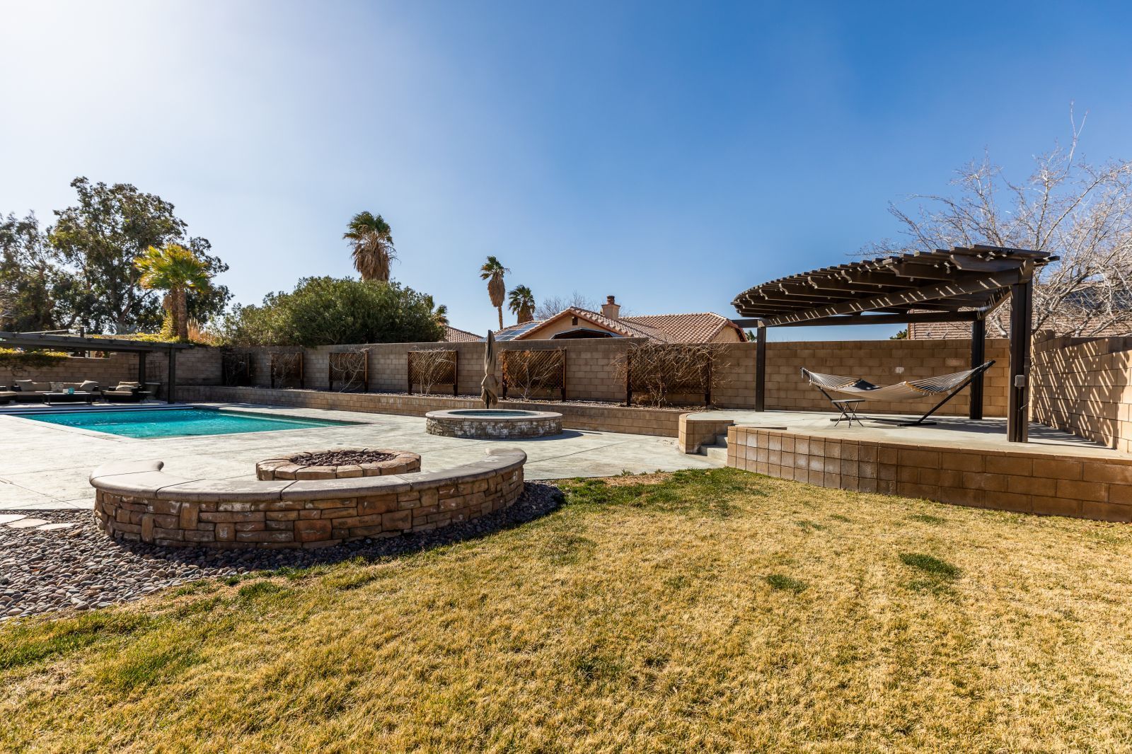 1219 Carolyn Street Ridgecrest, CA 93555 - Photo 40 of 47 a swimming pool with outdoor seating