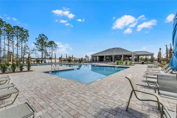a view of a lake from a balcony with outdoor space