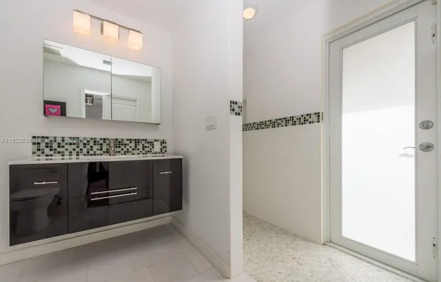 a hallway with washer and dryer