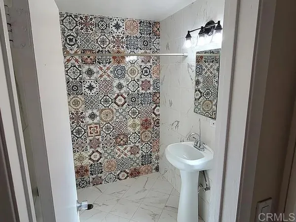 a bathroom with a sink and a mirror