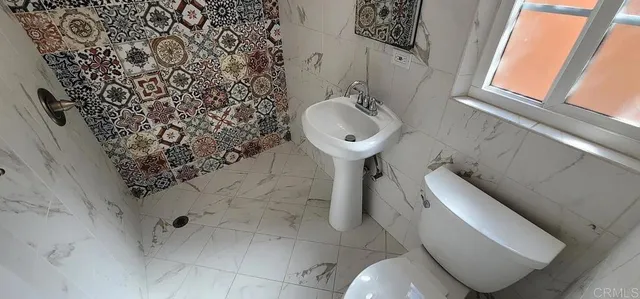 a bathroom with a sink and toilet
