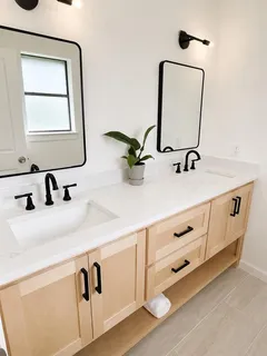 a bathroom with sink double vanity and mirror