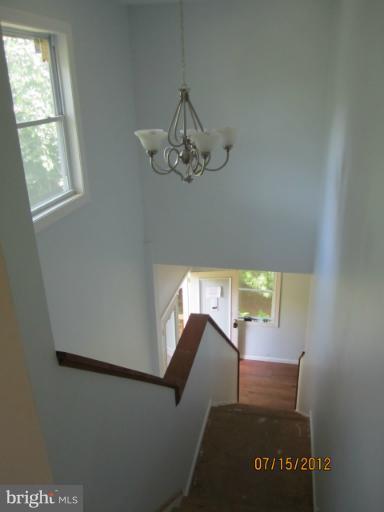 5129 Old National Pike Frederick, MD 21702 - Photo 8 of 14 a view of entryway and hall with wooden floor