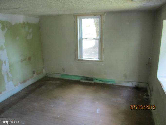 5129 Old National Pike Frederick, MD 21702 - Photo 9 of 14 a view of a room that has wooden floor and window