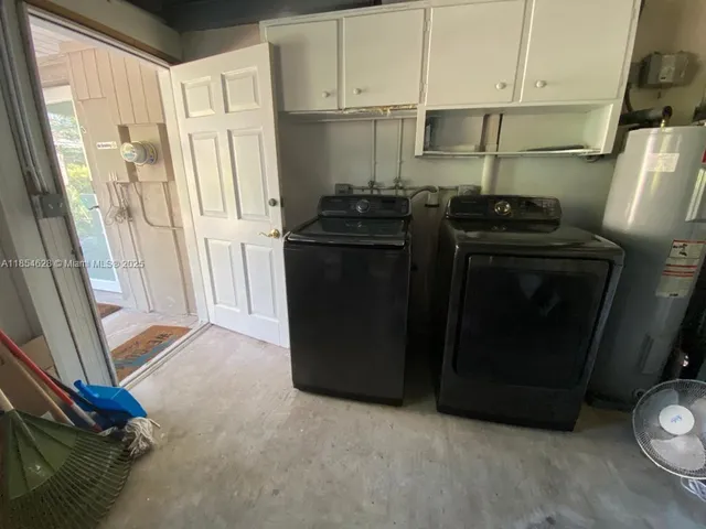 a view of walk in closet with wooden floor