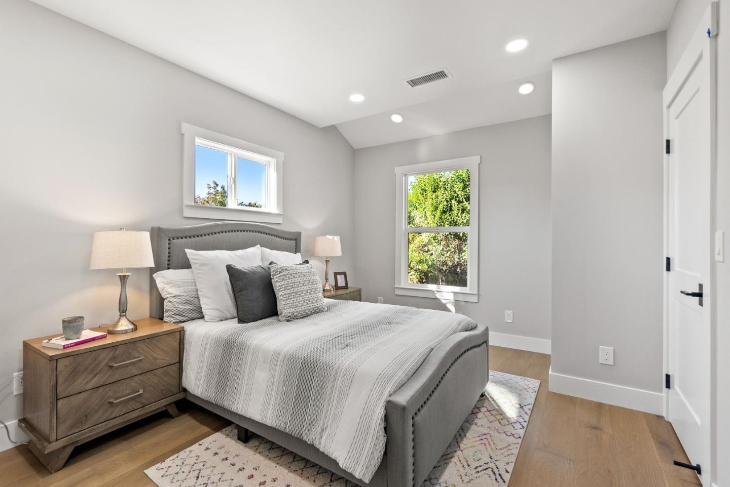 1587 Valota Road Redwood City, CA 94061 - Photo 14 of 42 a bedroom with a bed and a window