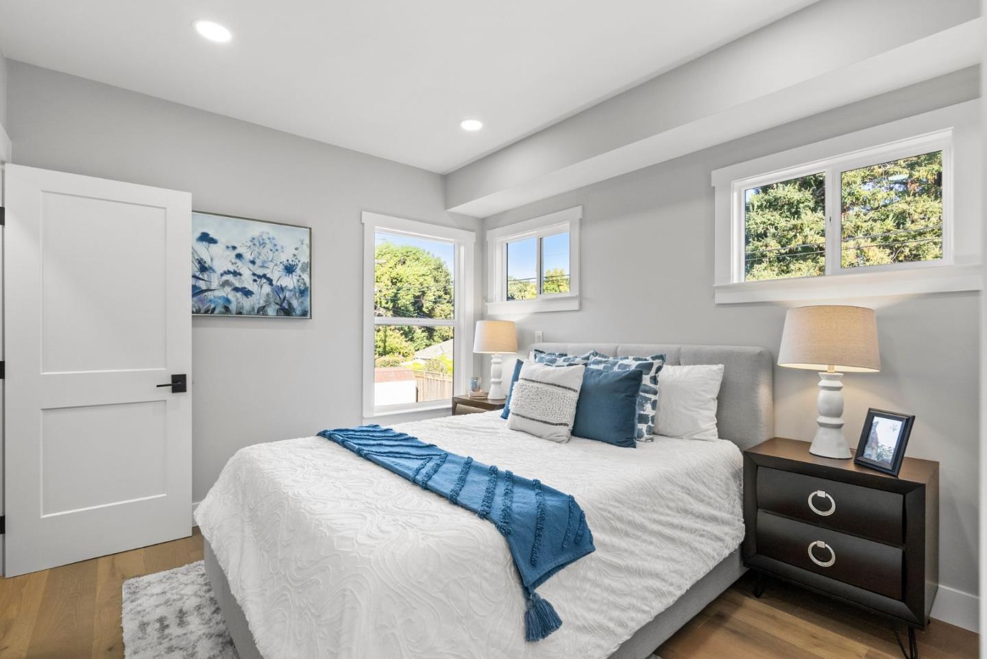 1587 Valota Road Redwood City, CA 94061 - Photo 19 of 42 a bedroom with a bed and a window