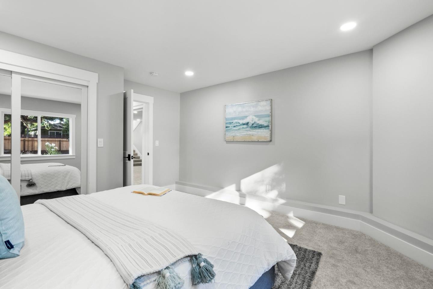1587 Valota Road Redwood City, CA 94061 - Photo 22 of 42 a bedroom with a bed and a painting on the wall