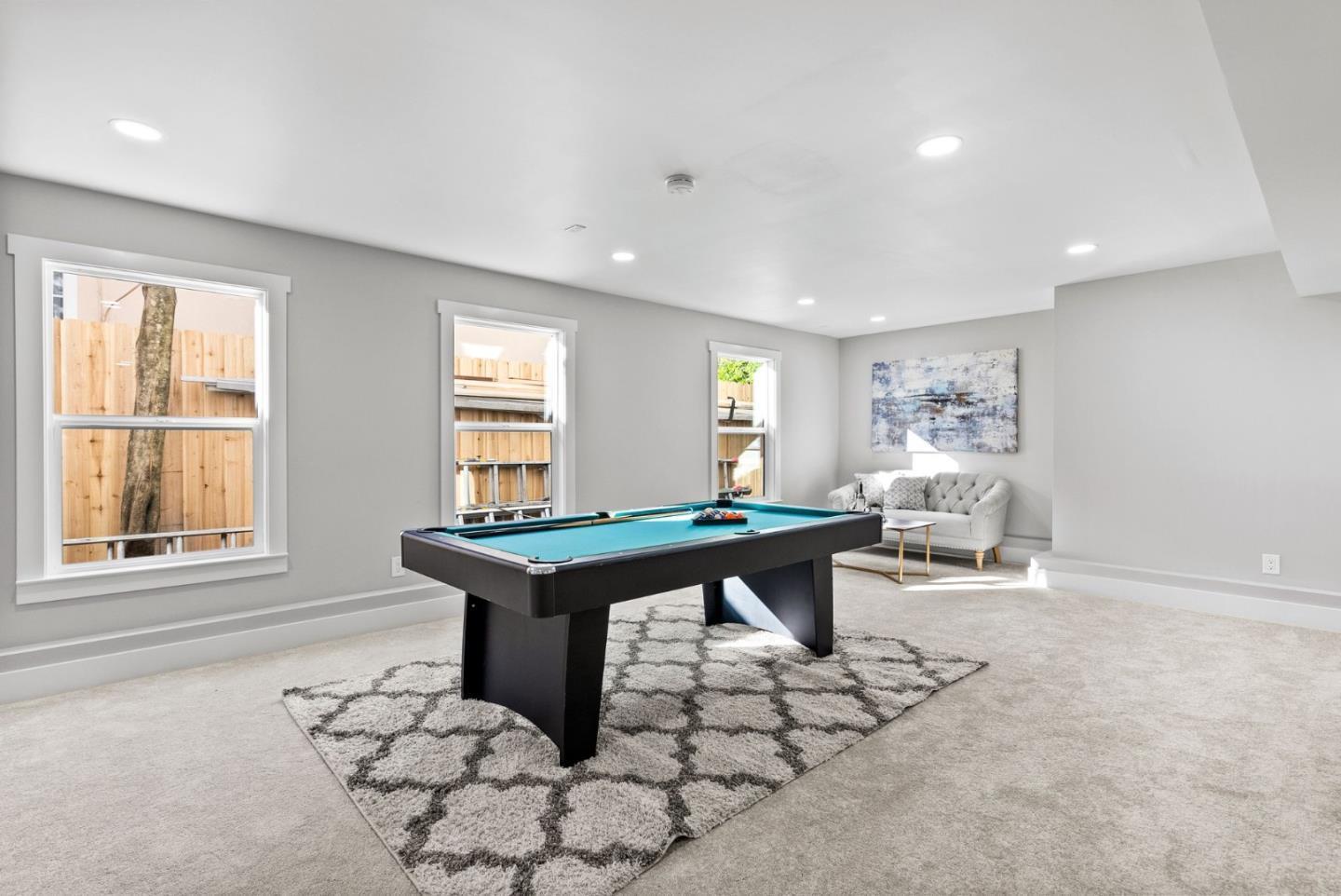 1587 Valota Road Redwood City, CA 94061 - Photo 29 of 42 a room with furniture a rug and a window