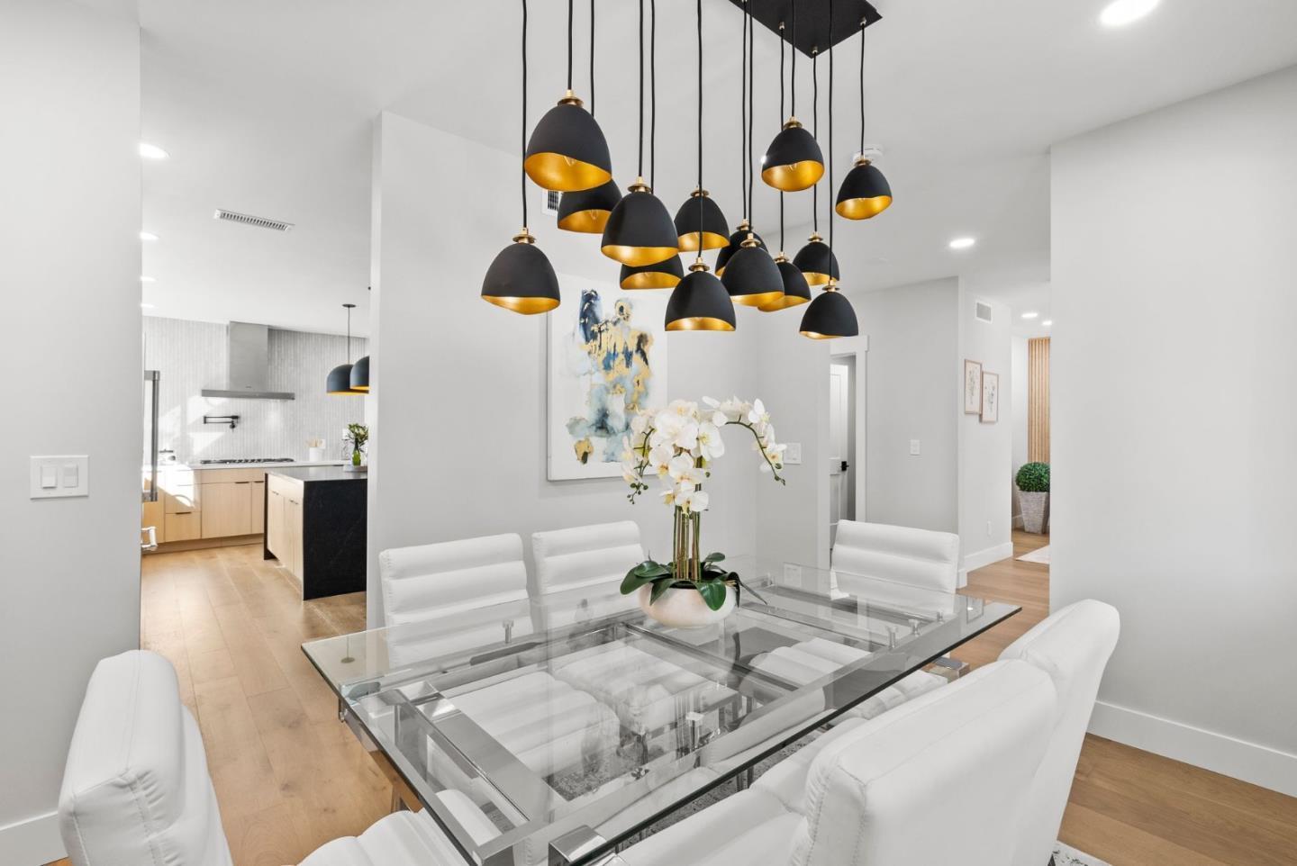 1587 Valota Road Redwood City, CA 94061 - Photo 6 of 42 a kitchen view with living room stove and chairs