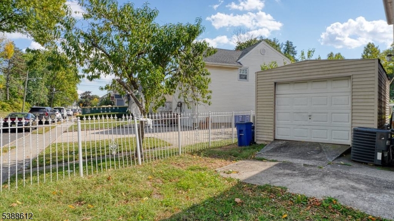 591 Cherry Street, Unit 1 Elizabeth, NJ 07208 - Photo 12 of 12 a view of a house with backyard and a tree