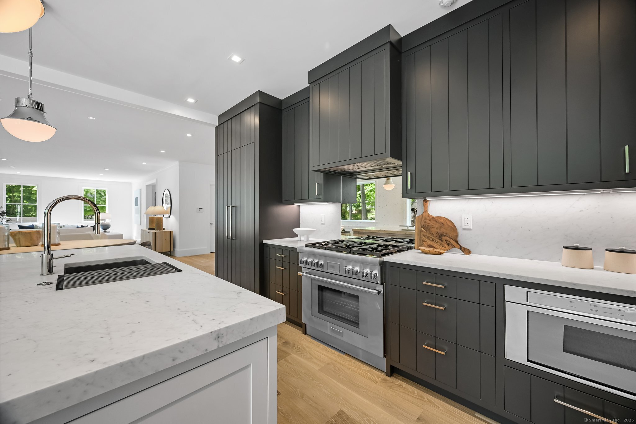 171 Compo Road South Westport, CT 06880 - Photo 13 of 39 a kitchen with granite countertop a sink stainless steel appliances and cabinets