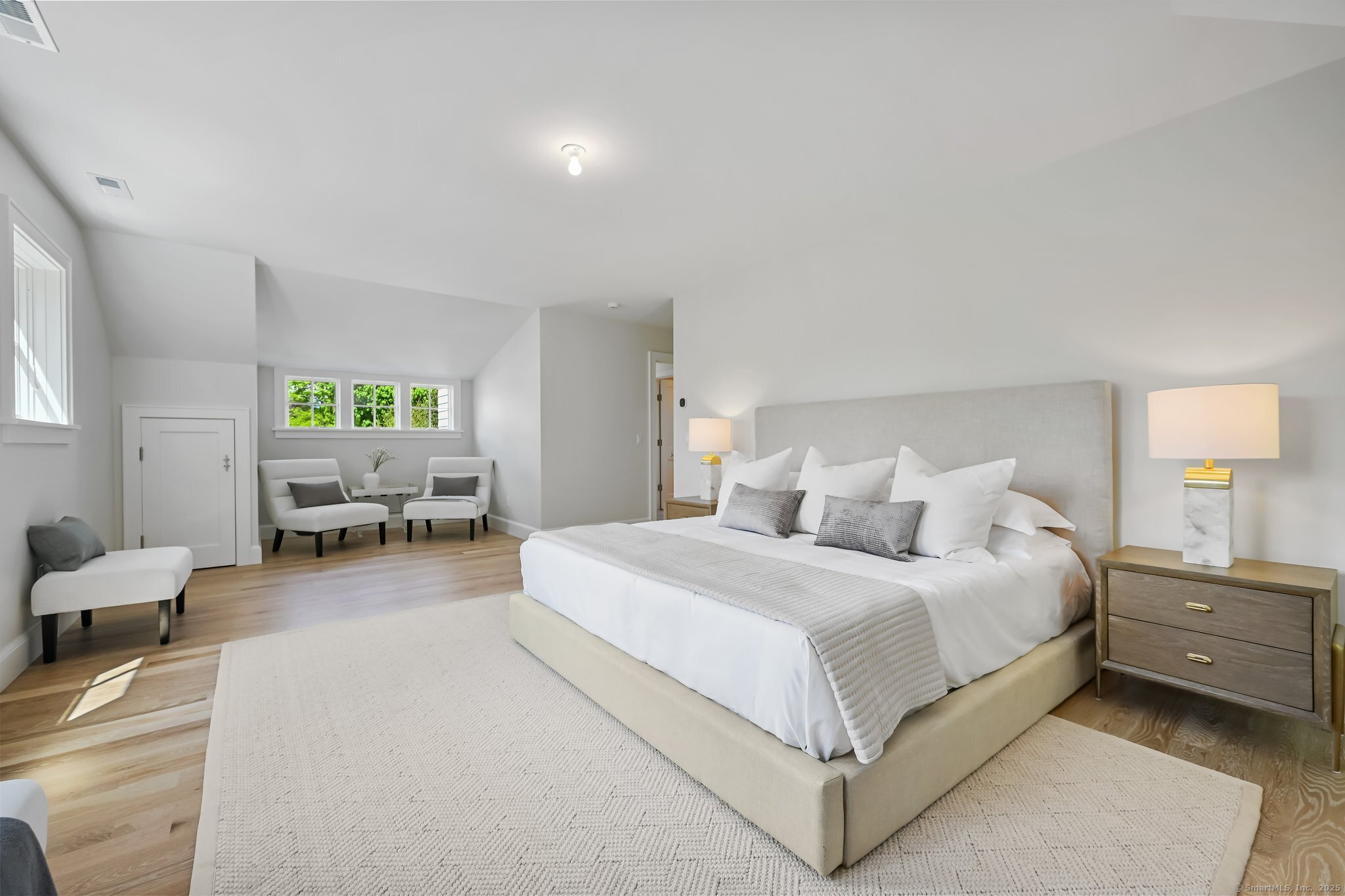 171 Compo Road South Westport, CT 06880 - Photo 18 of 39 a spacious bedroom with a bed and window