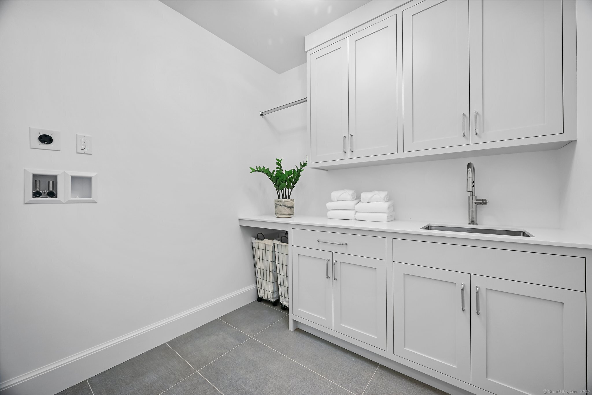 171 Compo Road South Westport, CT 06880 - Photo 24 of 39 a kitchen with white cabinets and sink
