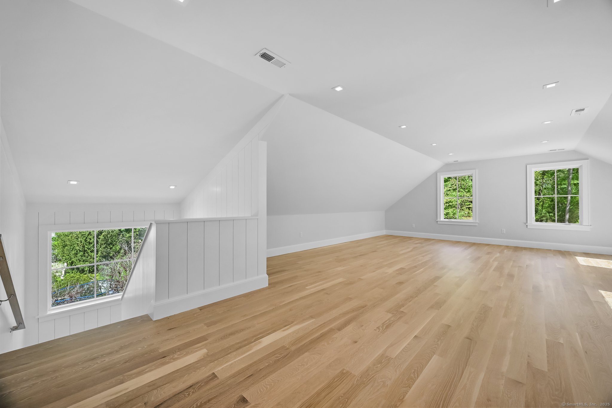 171 Compo Road South Westport, CT 06880 - Photo 28 of 39 an empty room with wooden floor and windows