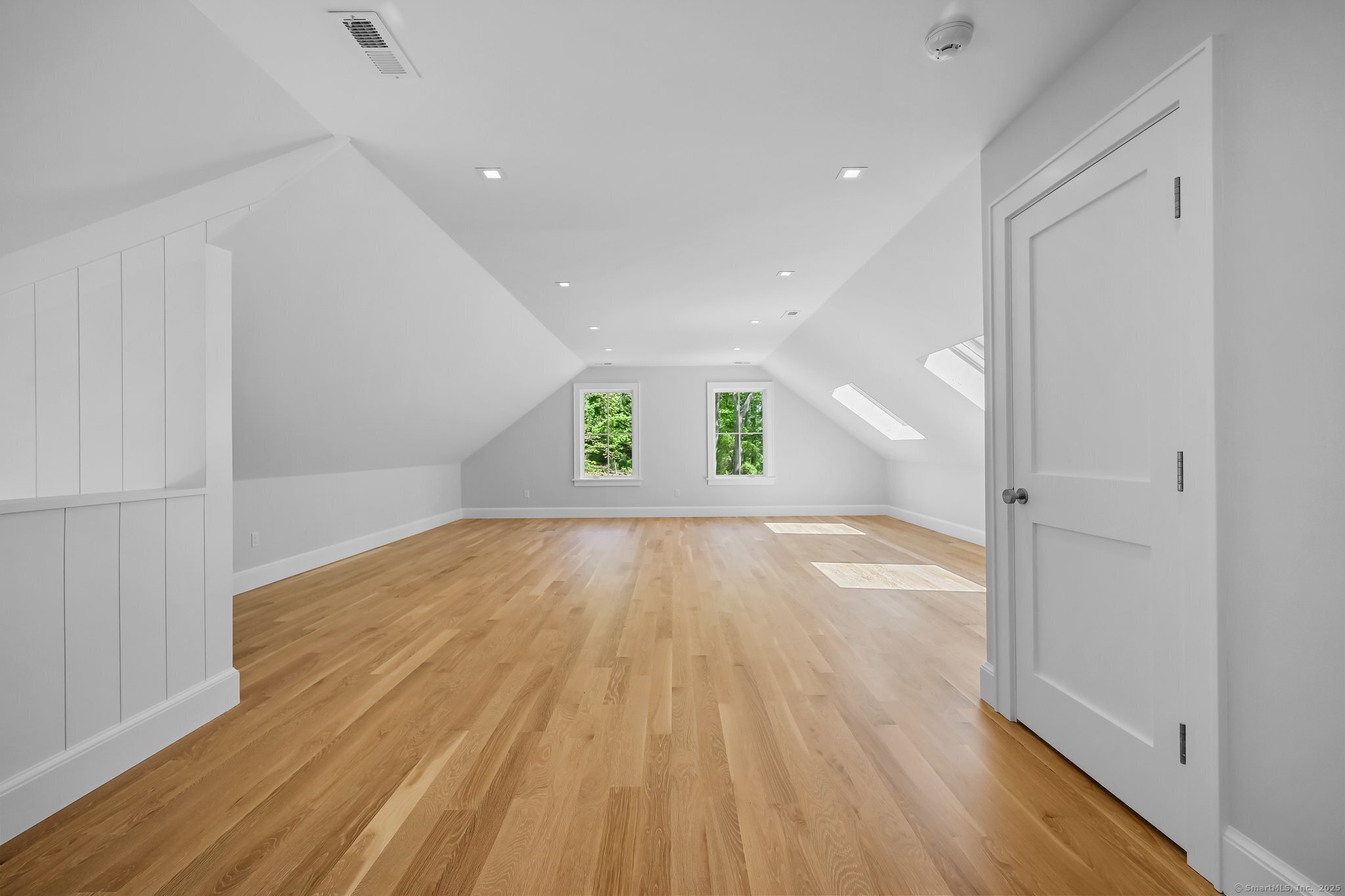 171 Compo Road South Westport, CT 06880 - Photo 29 of 39 wooden floor in an empty room with a window