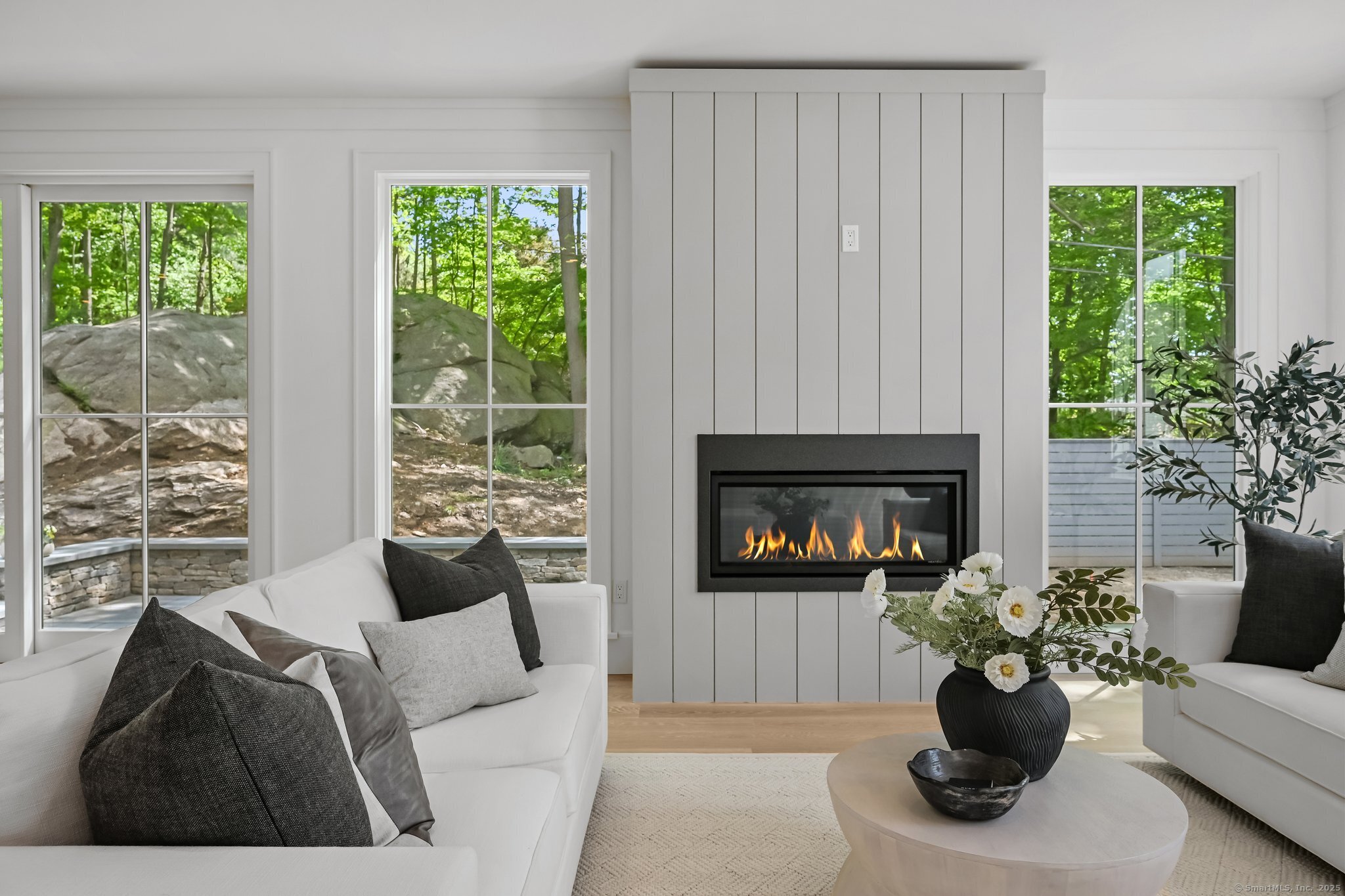 171 Compo Road South Westport, CT 06880 - Photo 4 of 39 a living room with furniture potted plant and a fireplace