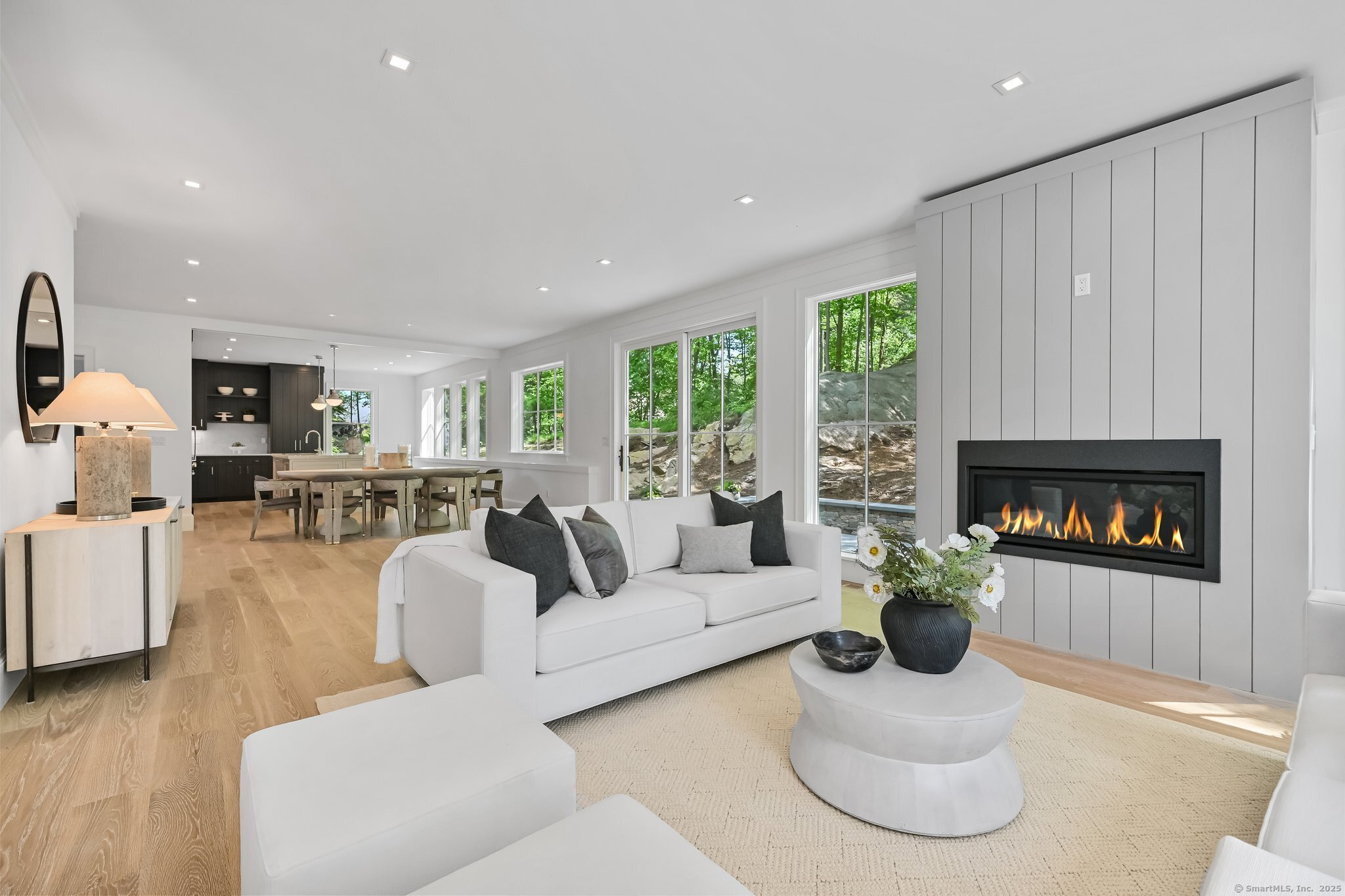 171 Compo Road South Westport, CT 06880 - Photo 6 of 39 a living room with furniture potted plant and a fireplace