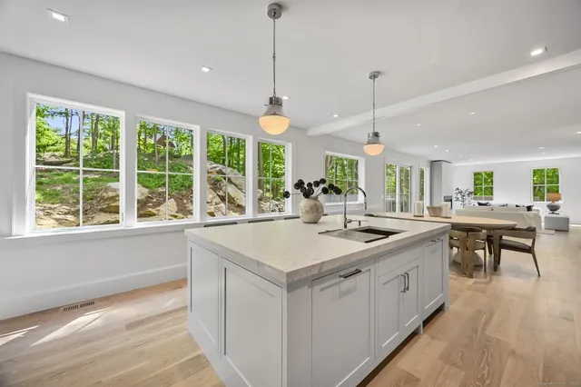 a living room with furniture and windows