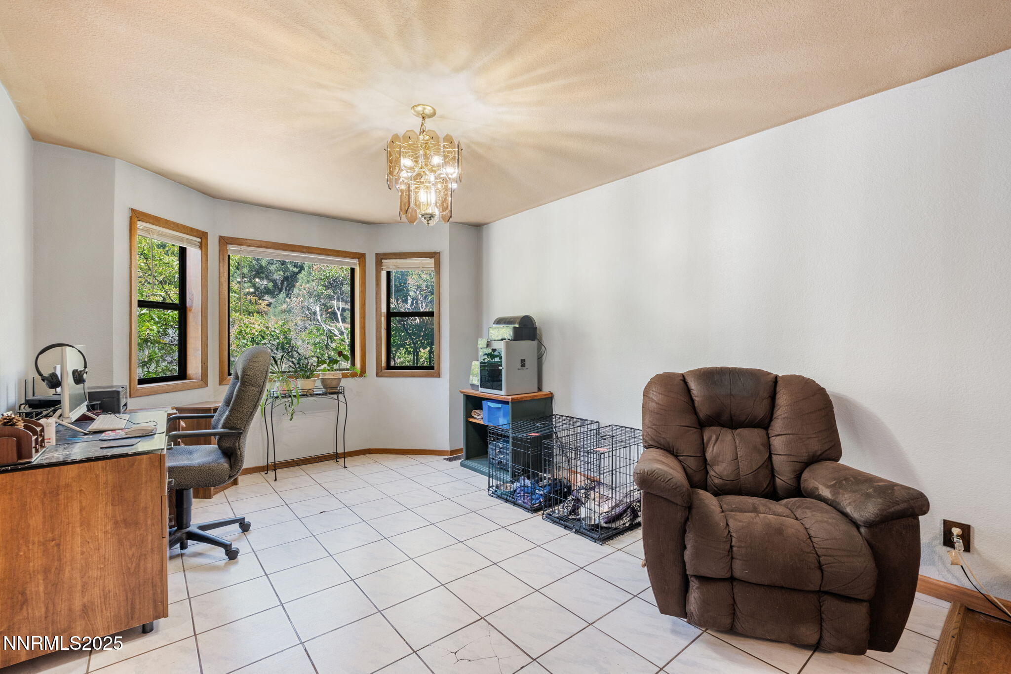 21615 Dortort Drive Reno, NV 89521 - Photo 15 of 52 a living room with furniture and a chandelier