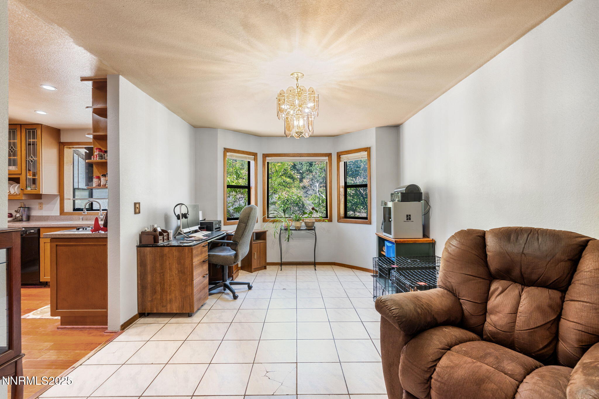 21615 Dortort Drive Reno, NV 89521 - Photo 17 of 52 a living room with furniture and a chandelier