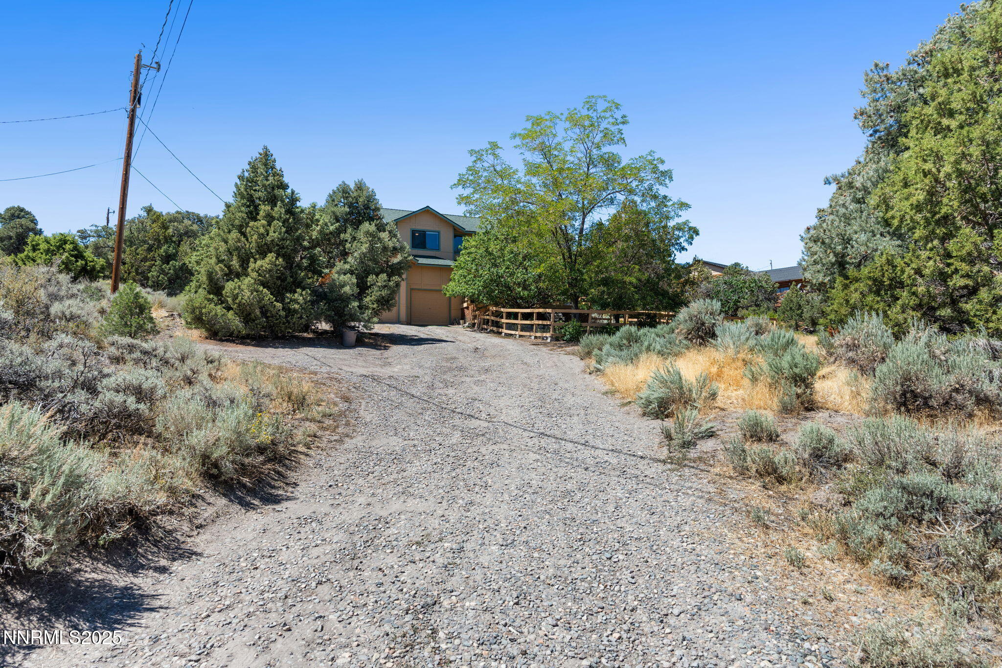 21615 Dortort Drive Reno, NV 89521 - Photo 2 of 52 a view of a dry yard with trees