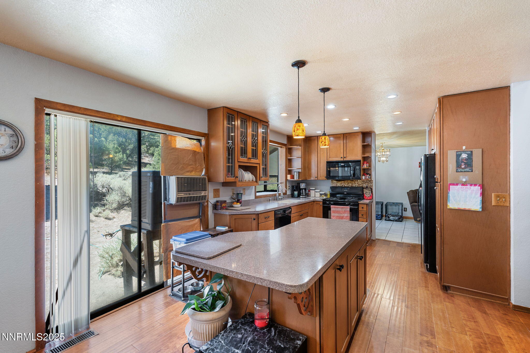 21615 Dortort Drive Reno, NV 89521 - Photo 23 of 52 a kitchen with a table chairs refrigerator and stove