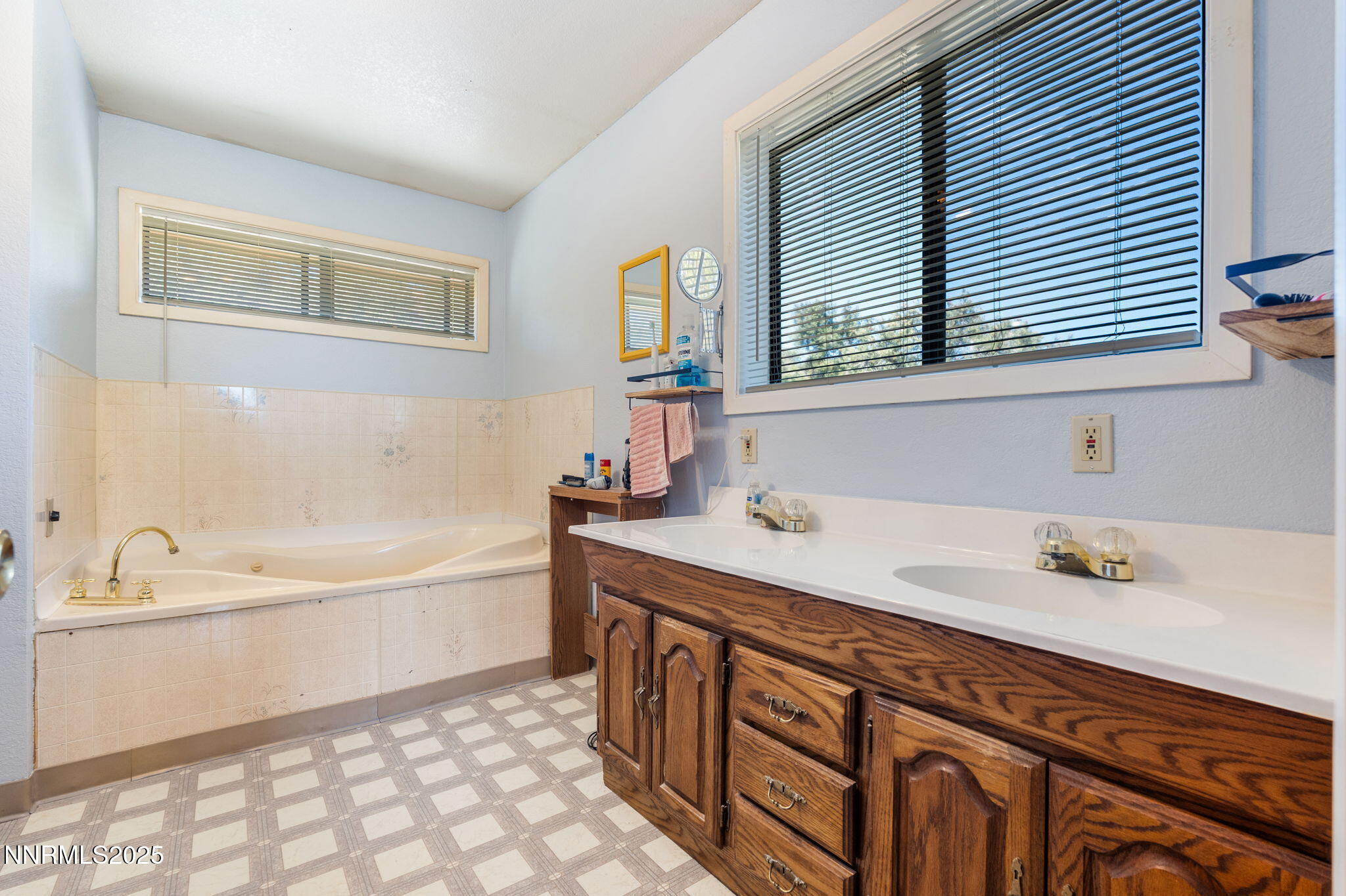 21615 Dortort Drive Reno, NV 89521 - Photo 32 of 52 a bathroom with a tub sink and mirror