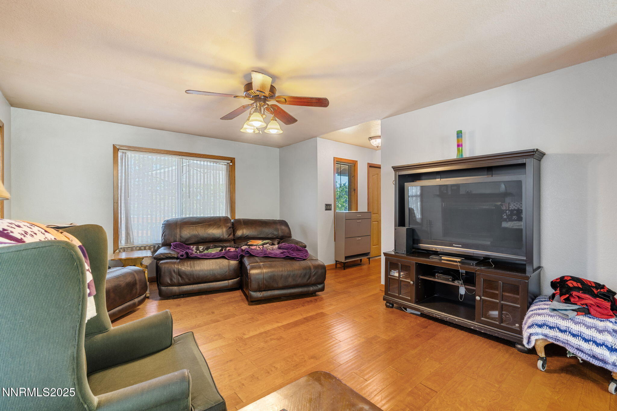 21615 Dortort Drive Reno, NV 89521 - Photo 9 of 52 a living room with furniture and a flat screen tv