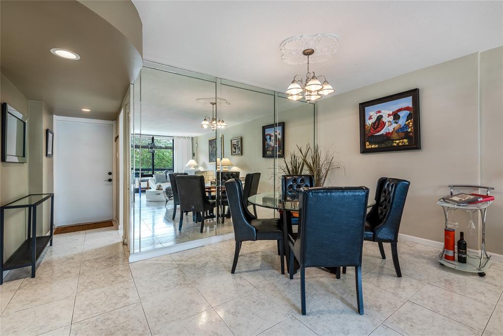 1401 South Federal Highway, Unit 122 Boca Raton, FL 33432 - Photo 11 of 29 a view of a dining room with furniture and chandelier