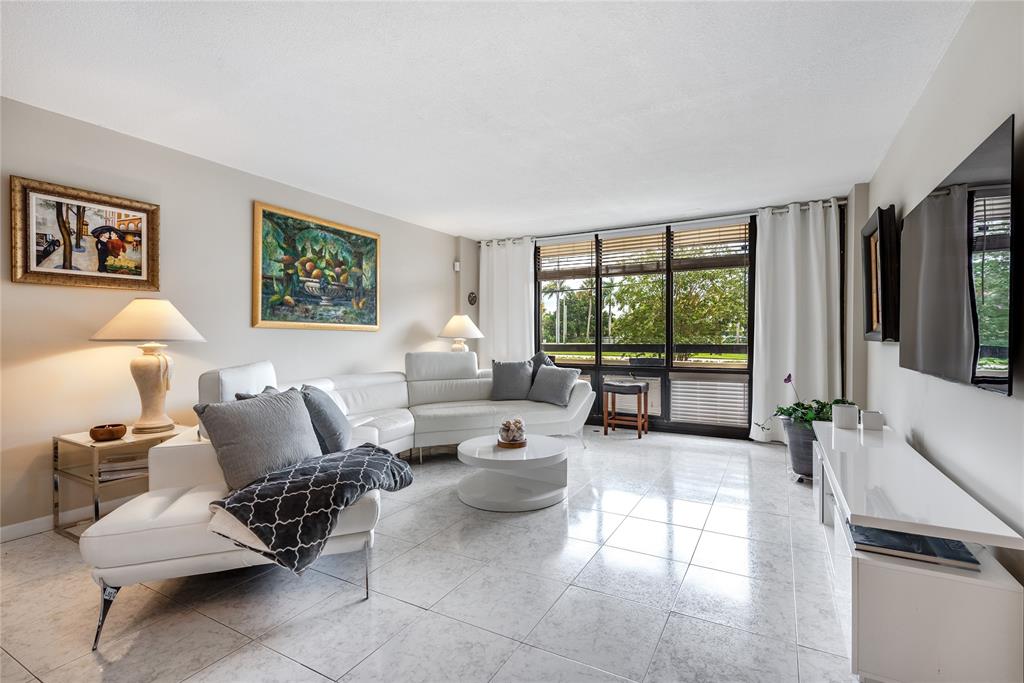 1401 South Federal Highway, Unit 122 Boca Raton, FL 33432 - Photo 12 of 29 a living room with furniture and a large window