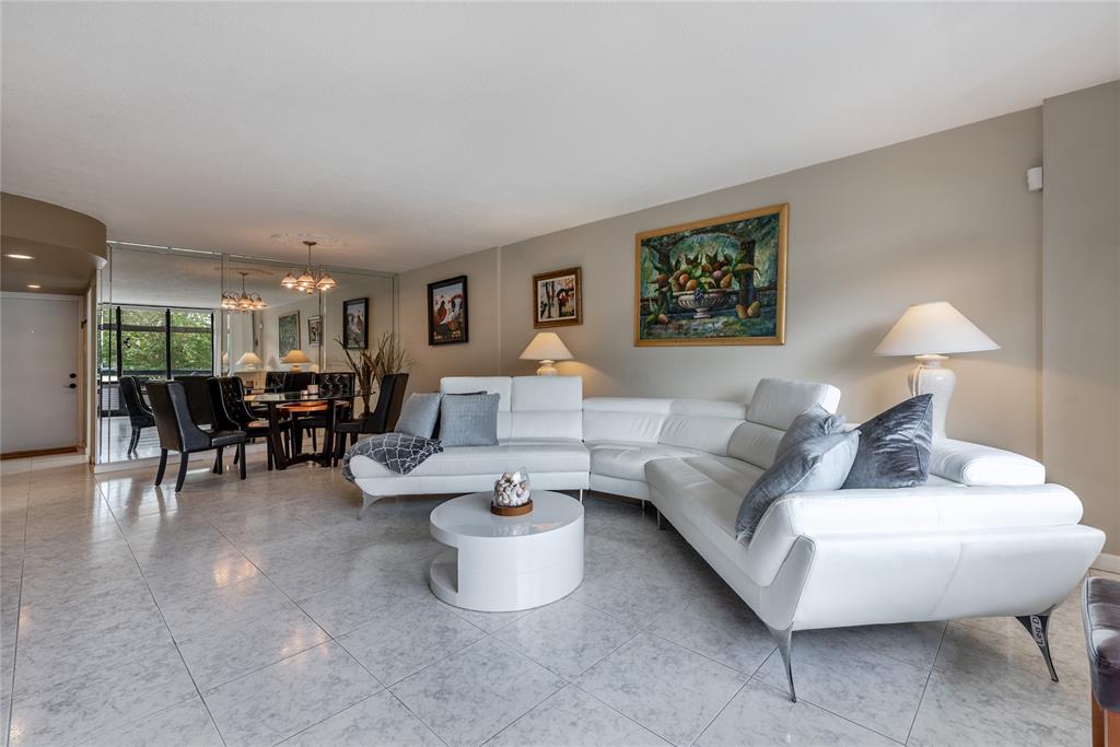 1401 South Federal Highway, Unit 122 Boca Raton, FL 33432 - Photo 14 of 29 a living room with furniture and a table